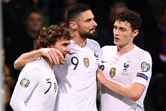 France's midfielder Antoine Griezmann (L) is congratulated by France's forward Olivier Giroud (C) and France's defender Benjamin Pavard after scoring a goal during the Euro 2020 qualifying football match between Moldova and France, on March 22, 2019 at Zimbru stadium in Chisinau. (Photo by FRANCK FIFE / AFP)        (Photo credit should read FRANCK FIFE/AFP/Getty Images)