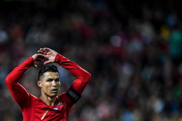 Portugal's forward Cristiano Ronaldo reacts during the Euro 2020 qualifying football match Portugal vs Ukraine at Luz stadium in Lisbon on March 22, 2019. (Photo by PATRICIA DE MELO MOREIRA / AFP)        (Photo credit should read PATRICIA DE MELO MOREIRA/AFP/Getty Images)