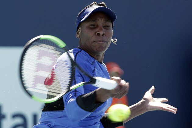 Venus Williams returns to Carla Suarez Navarro, of Spain, during the Miami Open tennis tournament, Friday, March 22, 2019, in Miami Gardens, Fla. (AP Photo/Lynne Sladky)