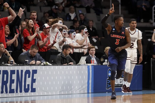 Liberty guard Lovell Cabbil Jr. celebrates after scoring against Mississippi State during the second half of a first-round game in the NCAA men’s college basketball tournament Friday, March 22, 2019, in San Jose, Calif. (AP Photo/Jeff Chiu)