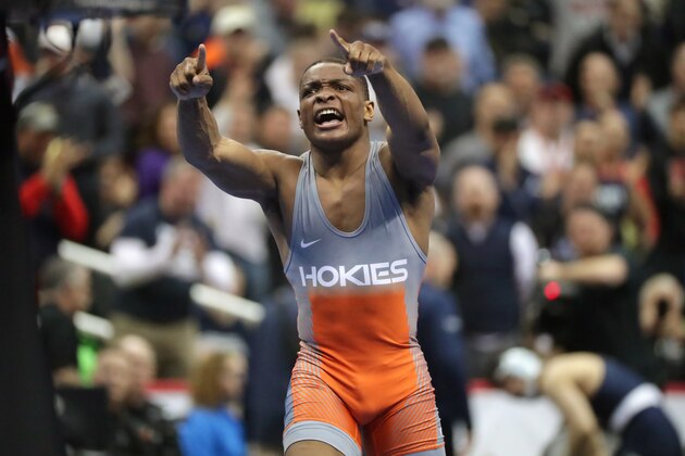 PITTSBURGH, PA - MARCH 22: Mekhi Lewis of the Virginia Tech Hokies celebrates after his upset victory over number one seed Alex Marinelli of the Iowa Hawkeyes during session three of the NCAA Wrestling Championships on March 22, 2019 at PPG Paints Arena in Pittsburgh, Pennsylvania. (Photo by Hunter Martin/NCAA Photos via Getty Images)