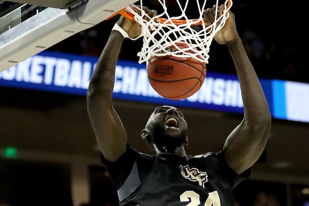 COLUMBIA, SOUTH CAROLINA - MARCH 22:  Tacko Fall #24 of the UCF Knights dunks the ball against Vince Williams #10 of the Virginia Commonwealth Rams in the first half during the first round of the 2019 NCAA Men's Basketball Tournament at Colonial Life Arena on March 22, 2019 in Columbia, South Carolina. (Photo by Streeter Lecka/Getty Images)