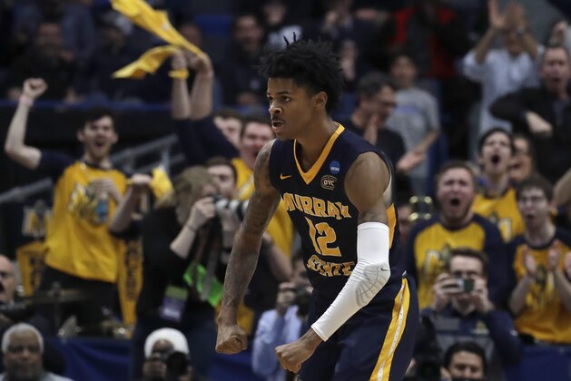 Fans cheer as Murray State's Ja Morant (12) celebrates a basket during the second half of a first round men's college basketball game against Marquette in the NCAA Tournament, Thursday, March 21, 2019, in Hartford, Conn. (AP Photo/Elise Amendola)