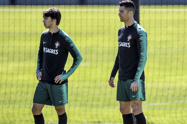 Portugal's forward Cristiano Ronaldo (R) and Portugal's forward Joao Felix attend a training session at 'City of Football' training camp in Oeiras, on March 20, 2019 ahead of the Euro 2020 qualifying football match Portugal vs Ukraine. (Photo by PATRICIA DE MELO MOREIRA / AFP)        (Photo credit should read PATRICIA DE MELO MOREIRA/AFP/Getty Images)