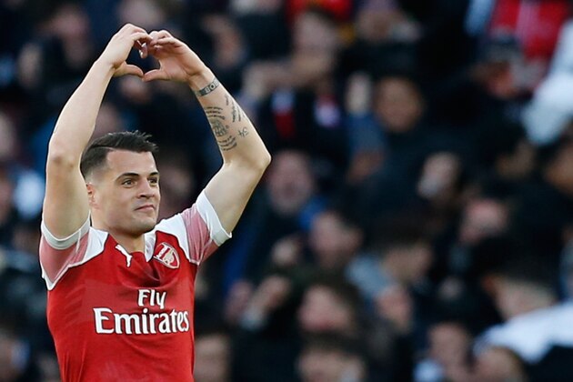 Arsenal's Swiss midfielder Granit Xhaka celebrates scoring the opening goal during the English Premier League football match between Arsenal and Manchester United at the Emirates Stadium in London on March 10, 2019. (Photo by Ian KINGTON / IKIMAGES / AFP) / RESTRICTED TO EDITORIAL USE. No use with unauthorized audio, video, data, fixture lists, club/league logos or 'live' services. Online in-match use limited to 45 images, no video emulation. No use in betting, games or single club/league/player publications. (Photo credit should read IAN KINGTON/AFP/Getty Images) Arsenal's Swiss midfielder Granit Xhaka celebrates scoring the opening goal during the English Premier League football match between Arsenal and Manchester United at the Emirates Stadium in London on March 10, 2019. (Photo by Ian KINGTON / IKIMAGES / AFP) / RESTRICTED TO EDITORIAL USE. No use with unauthorized audio, video, data, fixture lists, club/league logos or 'live' services. Online in-match use limited to 45 images, no video emulation. No use in betting, games or single club/league/player publications. (Photo credit should read IAN KINGTON/AFP/Getty Images)
