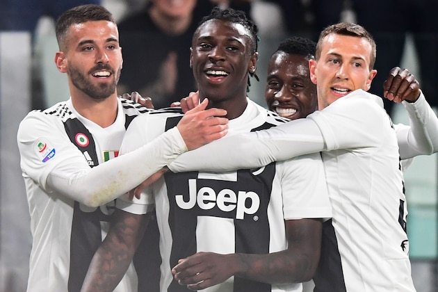 Juventus' Italian forward Moise Kean (C) celebrates opening the scoring with (From L) Juventus' Italian defender Leonardo Spinazzola, Juventus' French midfielder Blaise Matuidi and Juventus' Italian forward Federico Bernardeschi during the Italian Serie A football match Juventus vs Udinese on March 8, 2019 at the Juventus Allianz stadium in Turin. (Photo by Miguel MEDINA / AFP)        (Photo credit should read MIGUEL MEDINA/AFP/Getty Images)