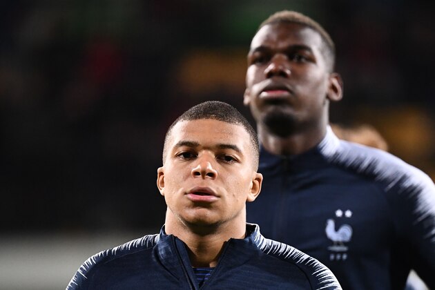 France's forward Kylian Mbappe (C) and France's midfielder Paul Pogba warm up ahead of the Euro 2020 qualifying football match between Moldova and France, on March 22, 2019 at Zimbru stadium in Chisinau. (Photo by FRANCK FIFE / AFP)        (Photo credit should read FRANCK FIFE/AFP/Getty Images)