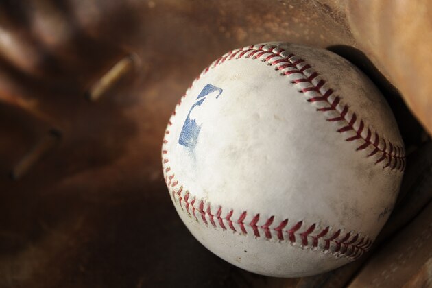 GLENDALE, AZ - FEBRUARY 19:  A batting practice baseball rests in a catchers mitt during Chicago White Sox spring training workouts on February 19, 2014 at The Ballpark at Camelback Ranch in Glendale, Arizona. (Photo by Ron Vesely/MLB Photos via Getty Images)  ***