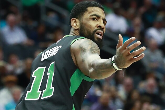 Boston Celtics guard Kyrie Irving reacts after a referee call while facing the Charlotte Hornets in the first half of an NBA basketball game Saturday, March 23, 2019, in Charlotte, N.C. (AP Photo/Jason E. Miczek)