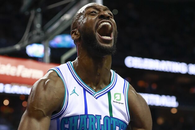 Charlotte Hornets guard Kemba Walker reacts after scoring and getting fouled by the Celtics in the second half of an NBA basketball game Saturday, March 23, 2019, in Charlotte, N.C. The Hornets won 124 - 117. (AP Photo/Jason E. Miczek)