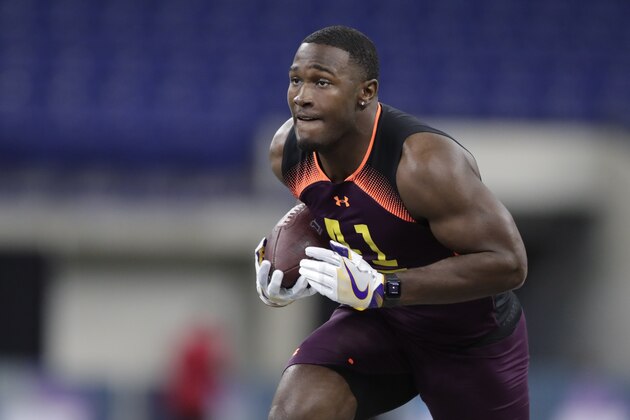 LSU linebacker Devin White runs a drill at the NFL football scouting combine in Indianapolis, Sunday, March 3, 2019. (AP Photo/Michael Conroy)