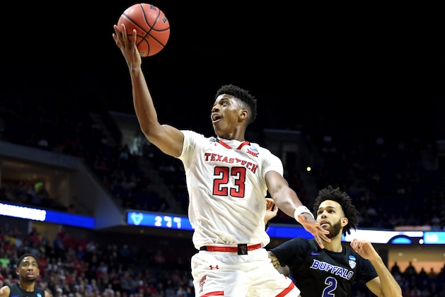 TULSA, OKLAHOMA - MARCH 24:  Jarrett Culver #23 of the Texas Tech Red Raiders scores on a lay up past Jeremy Harris #2 of the Buffalo Bulls during the first half of the second round game of the 2019 NCAA Men's Basketball Tournament at BOK Center on March 24, 2019 in Tulsa, Oklahoma. (Photo by Harry How/Getty Images)