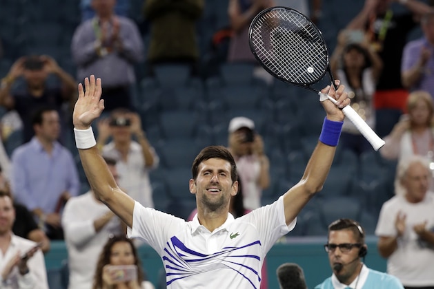 Novak Djokovic, of Serbia, celebrates after his match against Federico Delbonis, of Argentina, during the Miami Open tennis tournament, Sunday, March 24, 2019, in Miami Gardens, Fla. Djokovic won 7-5, 4-6, 6-1. (AP Photo/Lynne Sladky)