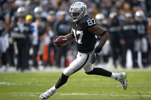 OAKLAND, CA - DECEMBER 09:  Jared Cook #87 of the Oakland Raiders runs with the ball after catching a pass against the Pittsburgh Steelers during the first half of an NFL football game at Oakland-Alameda County Coliseum on December 9, 2018 in Oakland, California.  (Photo by Thearon W. Henderson/Getty Images)
