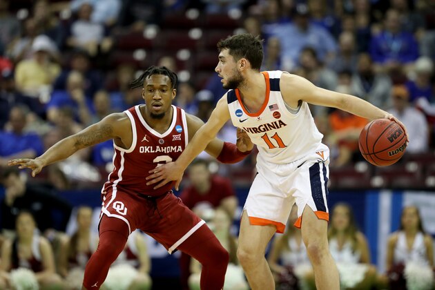 COLUMBIA, SOUTH CAROLINA - MARCH 24: Ty Jerome #11 of the Virginia Cavaliers dribbles against Aaron Calixte #2 of the Oklahoma Sooners during the first half in the second round game of the 2019 NCAA Men's Basketball Tournament at Colonial Life Arena on March 24, 2019 in Columbia, South Carolina. (Photo by Streeter Lecka/Getty Images)
