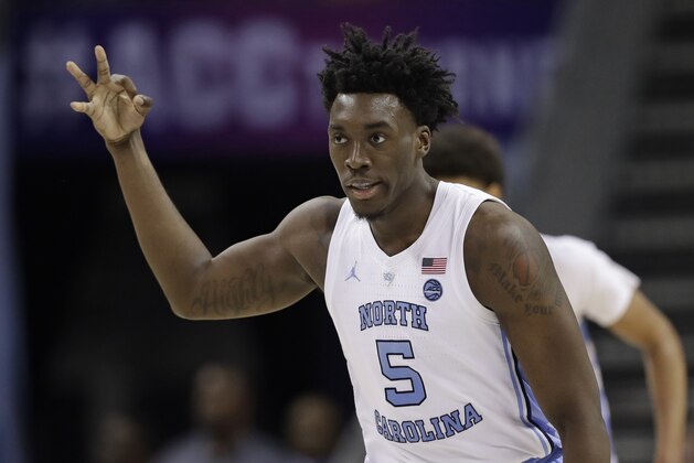 North Carolina's Nassir Little (5) reacts after making a basket against Louisville during the second half of an NCAA college basketball game in the Atlantic Coast Conference tournament in Charlotte, N.C., Thursday, March 14, 2019. (AP Photo/Chuck Burton)