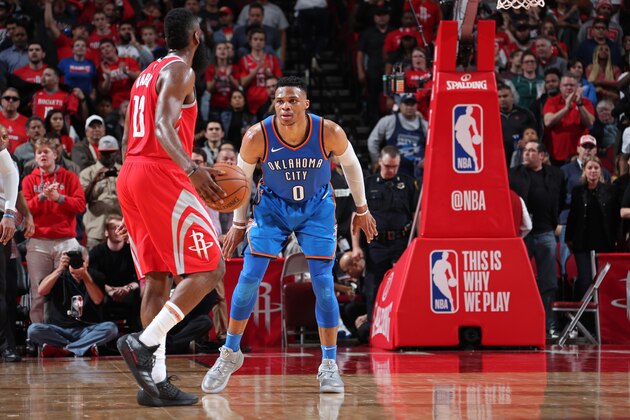 HOUSTON, TX - APRIL 7: James Harden #13 of the Houston Rockets handles the ball against Russell Westbrook #0 of the Oklahoma City Thunder on April 7, 2018 at the Toyota Center in Houston, Texas. NOTE TO USER: User expressly acknowledges and agrees that, by downloading and or using this photograph, User is consenting to the terms and conditions of the Getty Images License Agreement. Mandatory Copyright Notice: Copyright 2018 NBAE (Photo by Nathaniel S. Butler/NBAE via Getty Images)