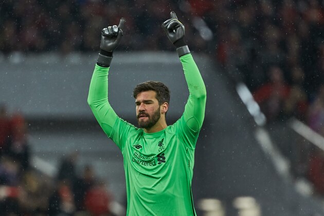 MUNICH, GERMANY - MARCH 13: goalkeeper Alisson Becker of Liverpool celebrates after his team's second goal during the UEFA Champions League Round of 16 Second Leg match between FC Bayern Muenchen and Liverpool at Allianz Arena on March 13, 2019 in Munich, Germany. (Photo by TF-Images/Getty Images)