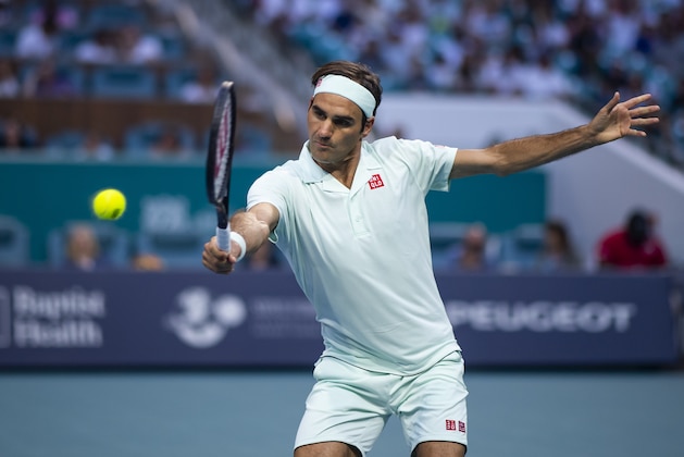 MIAMI GARDENS, FLORIDA - MARCH 23: Roger Federer of Switzerland hits a backhand against Radu Albot of Moldova in the  second round of the men's singles in the Miami Open at the Hard Rock stadium on March 23, 2019 in Miami Gardens, Florida. (Photo by TPN/Getty Images)