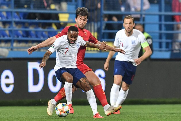 Montenegro's defender Filip Stojkovic (C) vies for the ball with England's forward Raheem Sterling (L) during the Euro 2020 football qualification match between Montenegro and England at Podgorica City Stadium on March 25, 2019 in Podgorica, Montenegro. (Photo by Andrej ISAKOVIC / AFP) (Photo credit should read ANDREJ ISAKOVIC/AFP/Getty Images) Montenegro's defender Filip Stojkovic (C) vies for the ball with England's forward Raheem Sterling (L) during the Euro 2020 football qualification match between Montenegro and England at Podgorica City Stadium on March 25, 2019 in Podgorica, Montenegro. (Photo by Andrej ISAKOVIC / AFP) (Photo credit should read ANDREJ ISAKOVIC/AFP/Getty Images)