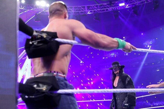 John Cena and The Undertaker at WrestleMania 34. John Cena and The Undertaker at WrestleMania 34.