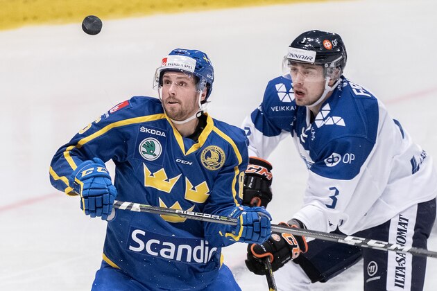Sweden's Mathias Brome (L) and Ville Pokka vie for the puck during the Beijer Hockey Games match between Sweden and Finland at Hovet arena in Stockholm, Sweden on February 10, 2019. (Photo by Jonas EKSTROMER / TT News Agency / AFP) / Sweden OUT        (Photo credit should read JONAS EKSTROMER/AFP/Getty Images)
