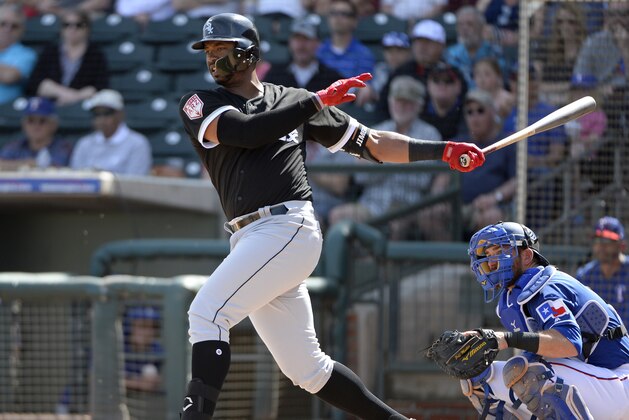 SURPRISE, ARIZONA - MARCH 01:  Eloy Jimenez #74 of the Chicago White Sox bats against the Texas Rangers on March 1, 2019 at Billy Parker Field at Surprise Stadium in Surprise Arizona.  (Photo by Ron Vesely/MLB Photos via Getty Images)