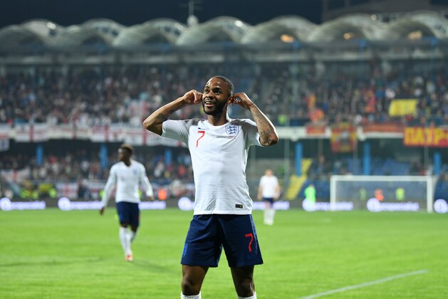 PODGORICA, MONTENEGRO - MARCH 25:  Raheem Sterling of England celebrates after scoring his team's fifth goal during the 2020 UEFA European Championships Group A qualifying match between Montenegro and England at Podgorica City Stadium on March 25, 2019 in Podgorica, Montenegro. (Photo by Michael Regan/Getty Images)