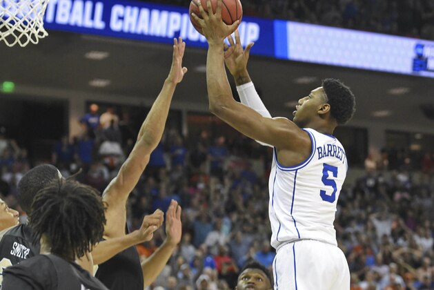Duke's RJ Barrett shoots the game-winning basket against Central Florida during the second half of a second round men's college basketball game in the NCAA Tournament in Columbia, S.C. Sunday, March 24, 2019. (AP Photo/Richard Shiro)