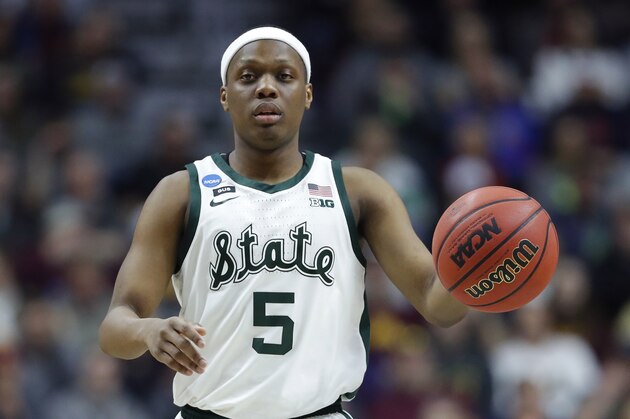 Michigan State guard Cassius Winston dribbles up court during a second round men's college basketball game against Minnesota in the NCAA Tournament, Saturday, March 23, 2019, in Des Moines, Iowa. (AP Photo/Charlie Neibergall)