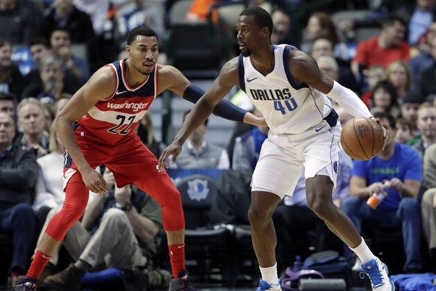 Washington Wizards' Otto Porter Jr. (22) defends as Dallas Mavericks' Harrison Barnes (40) handles the ball during an NBA basketball game, Monday, Jan. 22, 2018, in Dallas. (AP Photo/Tony Gutierrez)