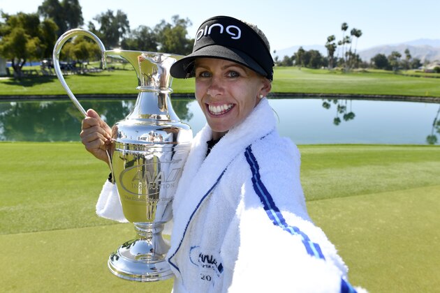 RANCHO MIRAGE, CA - APRIL 02:  Pernilla Lindberg of Sweden imitates a selfie as she poses with the winner's trophy after defeating Inbe Park of South Korea during the sudden death playoff on the eighth hole during the final round of the ANA Inspiration on the Dinah Shore Tournament Course at Mission Hills Country Club on April 2, 2018 in Rancho Mirage, California. Play resumed today after play was suspended due to darkness yesterday. (Photo by Robert Laberge/Getty Images)