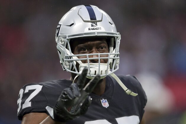Oakland Raiders tight end Jared Cook (87) gestures during the warm-up before an NFL football game against Seattle Seahawks at Wembley stadium in London, Sunday, Oct. 14, 2018. (AP Photo/Tim Ireland)