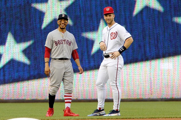 WASHINGTON, DC - JULY 03:  Mookie Betts #50 of the Boston Red Sox and Bryce Harper #34 of the Washington Nationals talk before the game at Nationals Park on July 3, 2018 in Washington, DC.  (Photo by Greg Fiume/Getty Images)
