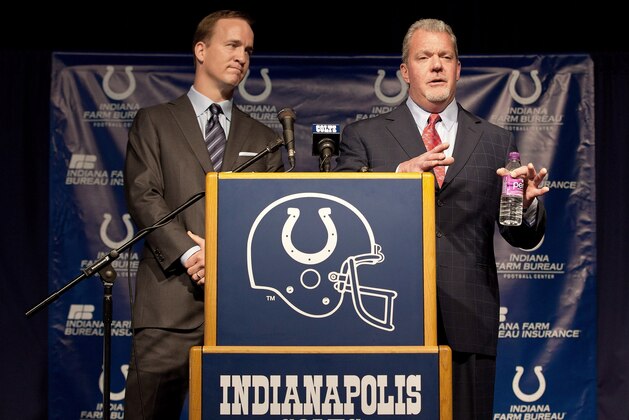 INDIANAPOLIS, IN - MARCH 07:  Peyton Manning (L) listens as Indianapolis Colts owner Jim Irsay speaks at a press conference announcing Manning's release from the Colts at Indiana Farm Bureau Football Center on March 7, 2012 in Indianapolis, Indiana.  (Photo by Joey Foley/Getty Images)