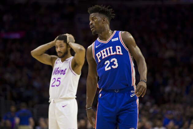 PHILADELPHIA, PA - JANUARY 15: Jimmy Butler #23 of the Philadelphia 76ers and Derrick Rose #25 of the Minnesota Timberwolves look on at the Wells Fargo Center on January 15, 2019 in Philadelphia, Pennsylvania. NOTE TO USER: User expressly acknowledges and agrees that, by downloading and or using this photograph, User is consenting to the terms and conditions of the Getty Images License Agreement. (Photo by Mitchell Leff/Getty Images)