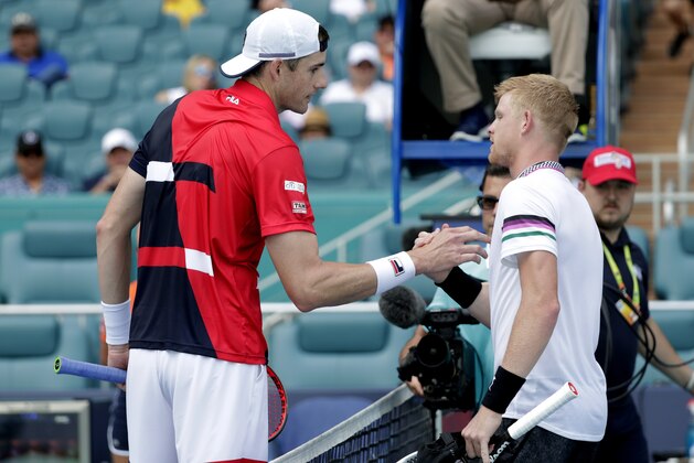John Isner, left, meets Kyle Edmund, of Great Britain, at the net after their match during the Miami Open tennis tournament, Tuesday, March 26, 2019, in Miami Gardens, Fla. Isner won 7-6 (5), 7-6 (3). (AP Photo/Lynne Sladky)