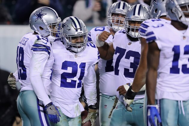 PHILADELPHIA, PA - NOVEMBER 11:  Running back Ezekiel Elliott #21 of the Dallas Cowboys celebrates his touchdown with teammate wide receiver Amari Cooper #19 against the Philadelphia Eagles during the fourth quarter at Lincoln Financial Field on November 11, 2018 in Philadelphia, Pennsylvania.  (Photo by Elsa/Getty Images)