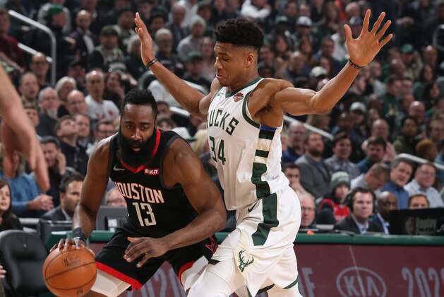 MILWAUKEE, WI - MARCH 26: James Harden #13 of the Houston Rockets handles the ball against Giannis Antetokounmpo #34 of the Milwaukee Bucks on March 26, 2019 at the Fiserv Forum in Milwaukee, Wisconsin. NOTE TO USER: User expressly acknowledges and agrees that, by downloading and or using this photograph, user is consenting to the terms and conditions of the Getty Images License Agreement. Mandatory Copyright Notice: Copyright 2019 NBAE (Photo by Gary Dineen/NBAE via Getty Images)