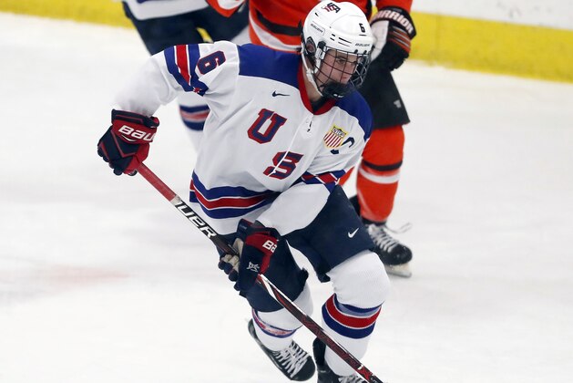In this Wednesday, Nov. 21, 2018, photo, Jack Hughes, foreground, expected to be a top pick in the next NHL hockey draft, plays against Bowling Green in Plymouth, Mich. USA Hockey has developed the nation's top players for more than two-plus decades, producing a quartet of No. 1 overall picks in the NHL draft, including Auston Matthews and Patrick Kane. Hughes may be next. (AP Photo/Carlos Osorio)