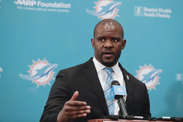 The new Miami Dolphins head coach Brian Flores speaks during a news conference on Monday, Feb. 4, 2019, in Davie, Fla. Hours after his team won the Super Bowl, New England Patriots linebackers coach Flores has been hired as head coach of the Miami Dolphins. (AP Photo/Brynn Anderson)