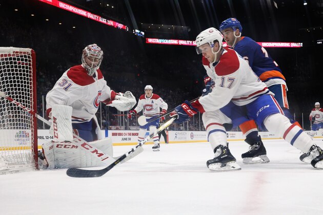 UNIONDALE, NEW YORK - MARCH 14: Carey Price #31 and Brett Kulak #17 of the Montreal Canadiens skate against the New York Islanders at NYCB Live's Nassau Coliseum on March 14, 2019 in Uniondale, New York. The Islanders defeated the Canadiens 2-1. (Photo by Bruce Bennett/Getty Images)