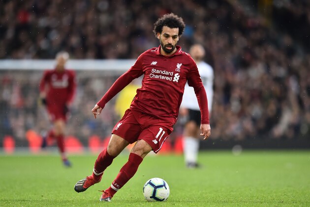 Liverpool's Egyptian midfielder Mohamed Salah controls the ball during the English Premier League football match between Fulham and Liverpool at Craven Cottage in London on March 17, 2019. (Photo by Glyn KIRK / AFP) / RESTRICTED TO EDITORIAL USE. No use with unauthorized audio, video, data, fixture lists, club/league logos or 'live' services. Online in-match use limited to 120 images. An additional 40 images may be used in extra time. No video emulation. Social media in-match use limited to 120 images. An additional 40 images may be used in extra time. No use in betting publications, games or single club/league/player publications. /         (Photo credit should read GLYN KIRK/AFP/Getty Images)