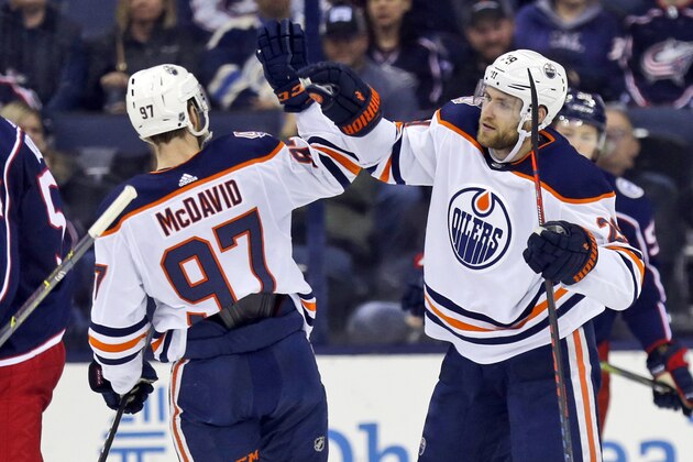 Edmonton Oilers forward Leon Draisaitl, right, of Germany, celebrates his goal against the Columbus Blue Jackets with teammate forward Connor McDavid during the second period of an NHL hockey game in Columbus, Ohio, Saturday, March 2, 2019. (AP Photo/Paul Vernon)
