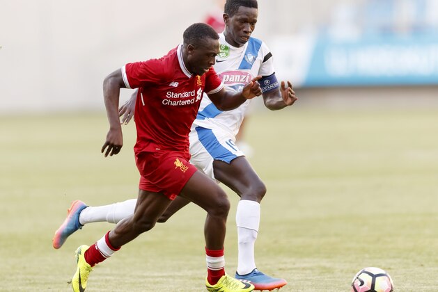 BUDAPEST, HUNGARY - JULY 18: Thiam Khaly Iyane (R) of MTK Budapest II competes for the ball with Bobby Adekanye (L) of FC Liverpool U23 during the Preseason Friendly match between MTK Budapest II and FC Liverpool U23 at Nandor Hidegkuti Stadium on July 18, 2017 in Budapest, Hungary. (Photo by Laszlo Szirtesi/Getty Images)