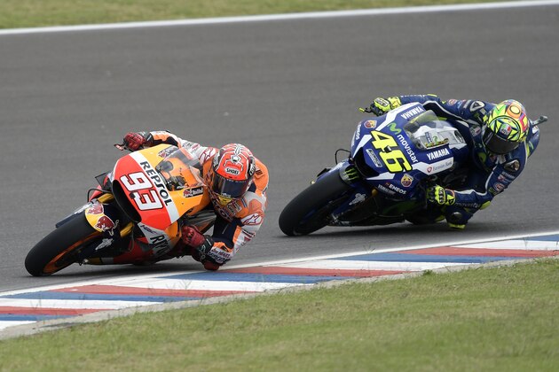 Spain's Marc Marquez (L) of Honda rides ahead of Italy's Valentino Rossi of Yamaha during the MotoGP race of the Argentina Grand Prix at Termas de Rio Hondo circuit, in Santiago del Estero, Argentina, on April 3, 2016. AFP PHOTO / JUAN MABROMATA / AFP / JUAN MABROMATA        (Photo credit should read JUAN MABROMATA/AFP/Getty Images)