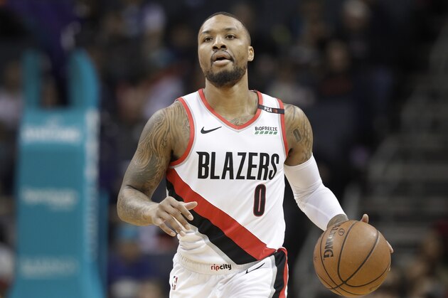 Portland Trail Blazers' Damian Lillard (0) brings the ball up court against the Charlotte Hornets during the first half of an NBA basketball game in Charlotte, N.C., Sunday, March 3, 2019. (AP Photo/Chuck Burton)