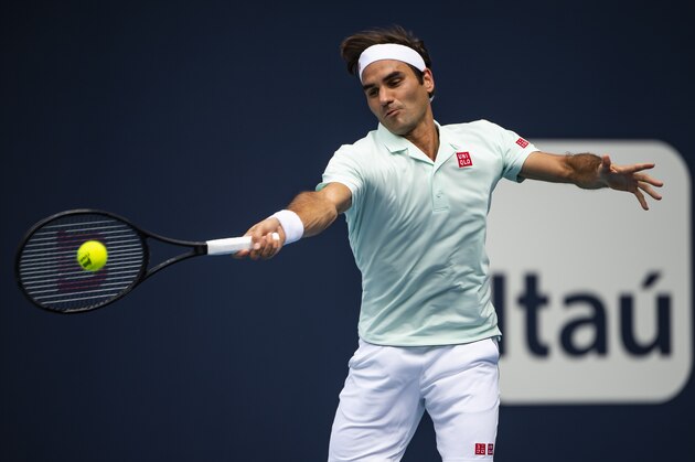 MIAMI GARDENS, FLORIDA - MARCH 25: Roger Federer of Switzerland hits a forehand against Filip Krajinovic of Serbia in the 3rd round of the men's singles at the Miami Open on March 25, 2019 in Miami Gardens, Florida. (Photo by TPN/Getty Images)
