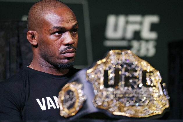 FILE - In this Jan. 31, 2019, file photo, Light heavyweight champion Jon Jones attends a news conference for the UFC 235 mixed martial arts event in Las Vegas. Jones will be allowed to fight at UFC 235 on Saturday despite two recent drug tests showing traces of a steroid metabolite, the Nevada State Athletic Commission announced Thursday, Feb. 28, 2019, The commission affirmed its belief that the tests do not reflect new drug use and believes the two positive tests conducted Feb. 14 and 15 uncovered residual results from the drug intake that resulted in a 15-month suspension for Jones in 2017. (AP Photo/John Locher, File)