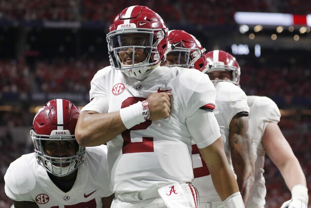 Alabama quarterback Jalen Hurts (2) celebrates his touchdown against Georgia during the second half of the Southeastern Conference championship NCAA college football game, Saturday, Dec. 1, 2018, in Atlanta. (AP Photo/John Bazemore)